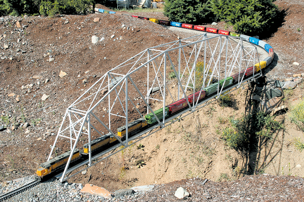 Model train on a truss bridge