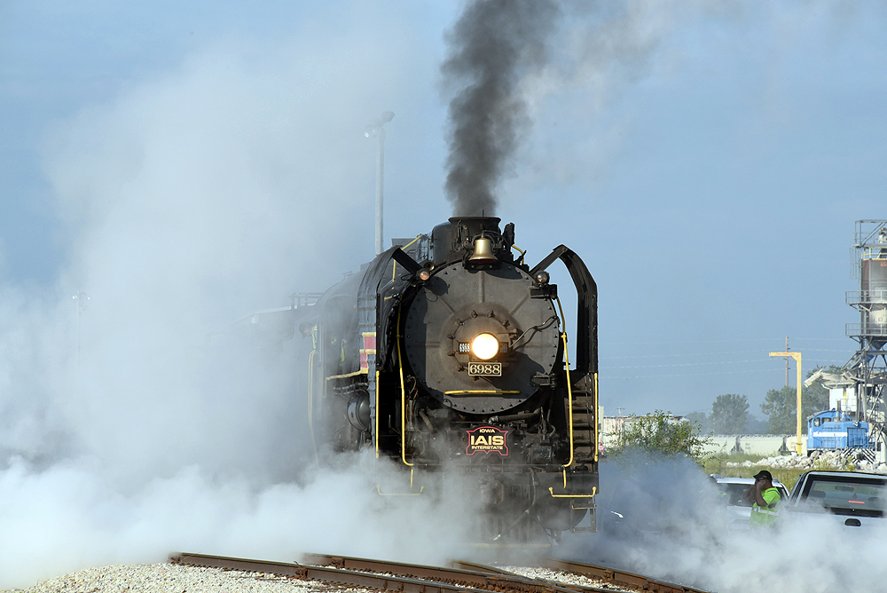 Steam locomotive shrouded by steam.