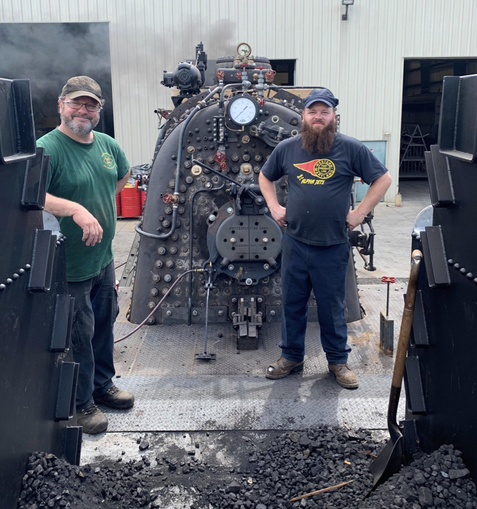 Two men with locomotive backhead