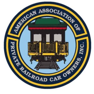 Round logo with end of open observation car