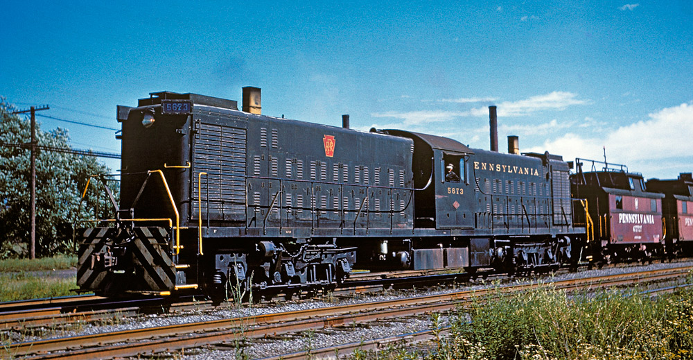 Color three-quarter-angle photo of transfer-style diesel locomotive.