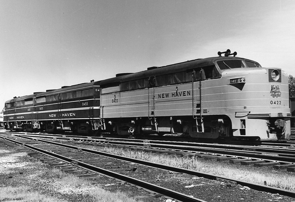 Black-and-white three-quarter-angle photo of three-unit streamlined diesel locomotive.