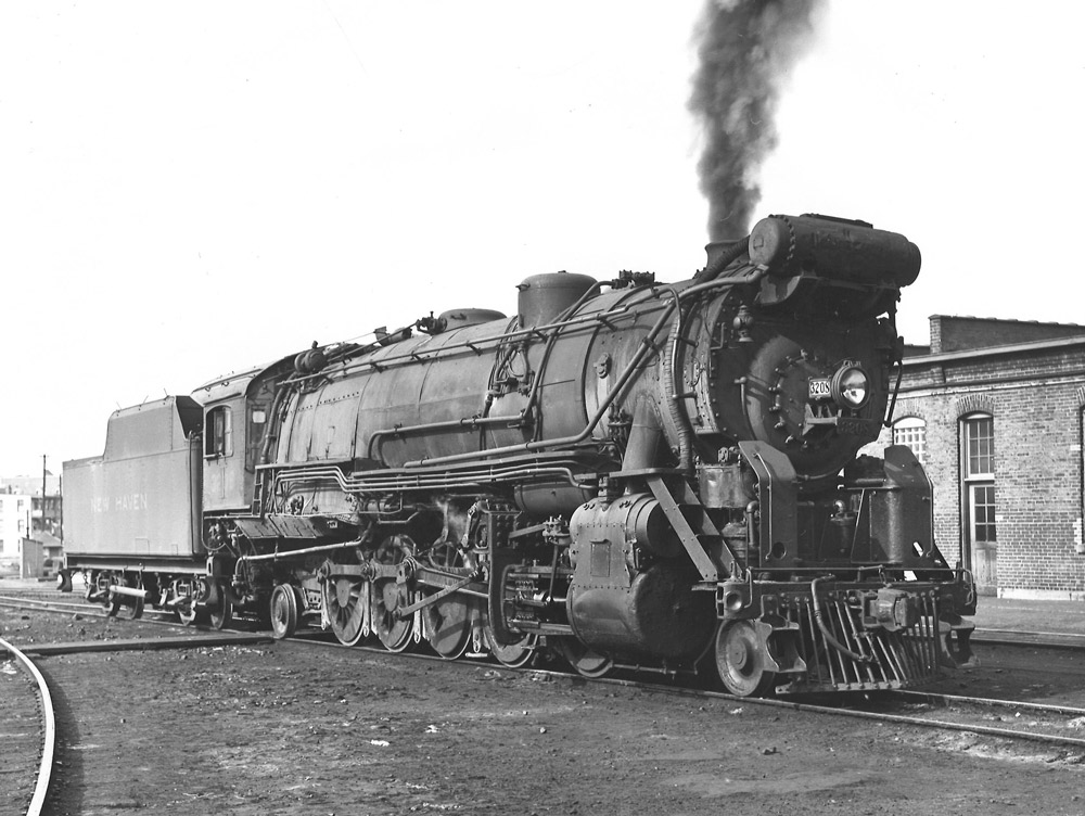 Black-and-white three-quarter-angle photo of 2-10-2 steam locomotive.