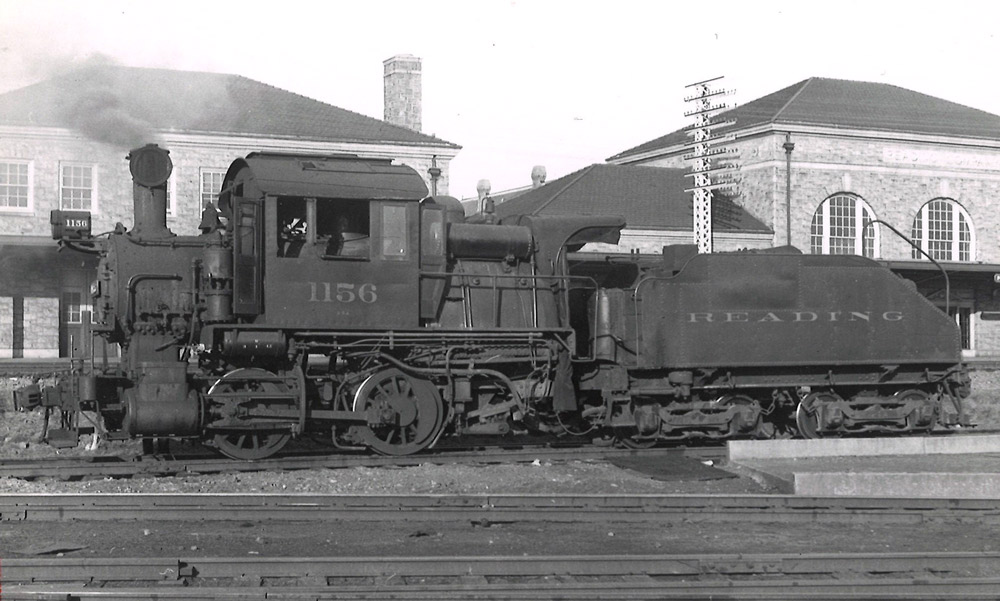 Black-and-white left-side photo of Camelback 0-4-0 steam locomotive at rest