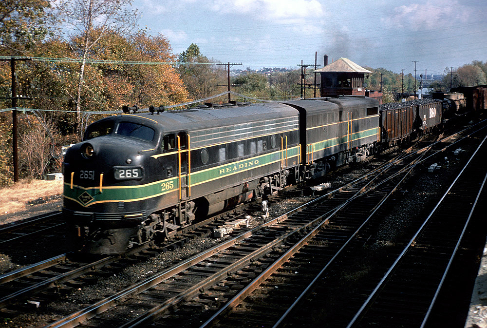 Color photo of two streamlined diesel locomotives with Reading Company freight train