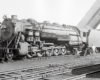 Black-and-white left-side photo of 2-10-2 steam locomotive at rest