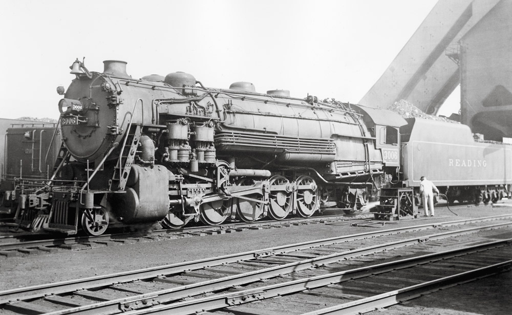 Black-and-white left-side photo of 2-10-2 steam locomotive at rest