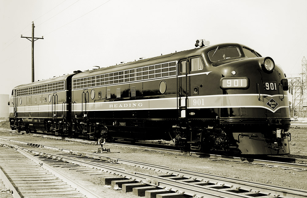 Black-and-white three-quarter-angle photo of two streamlined diesel locomotives