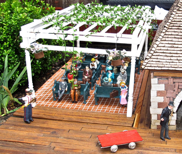 Model restaurant scene with pergola