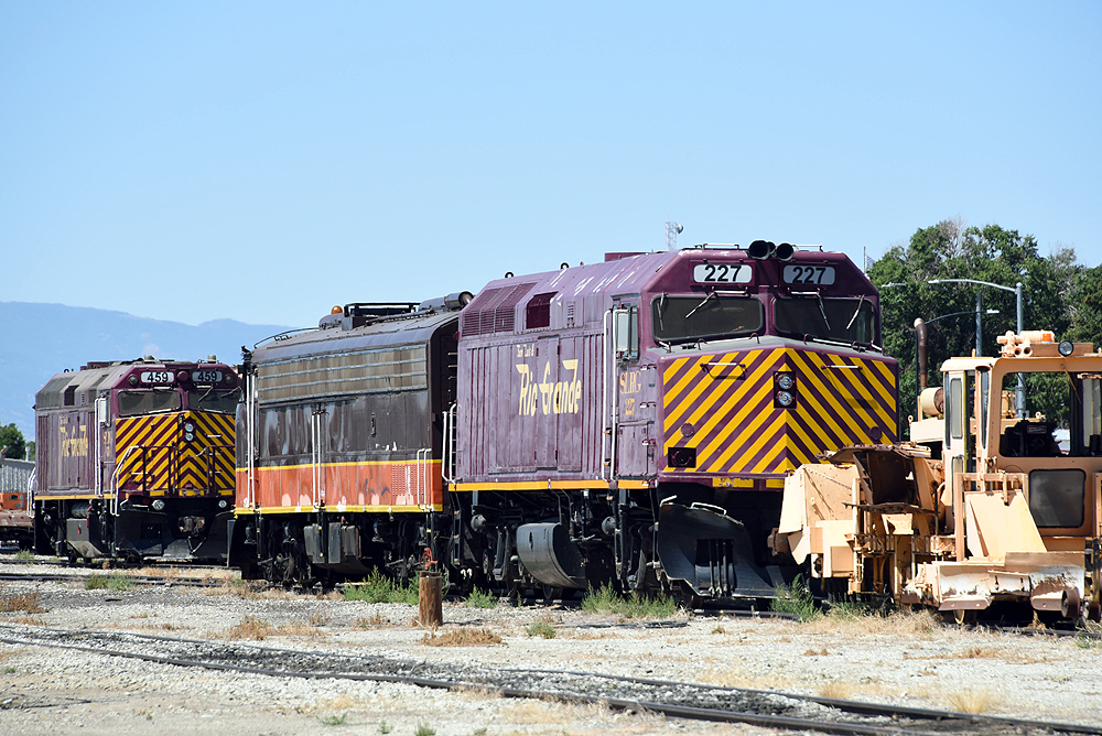 Diesel locomotives in a rail yard.