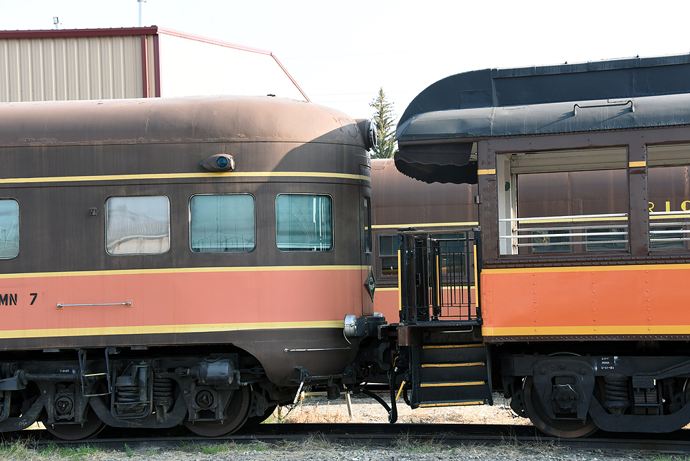 Tails of two observation cars coupled together.
