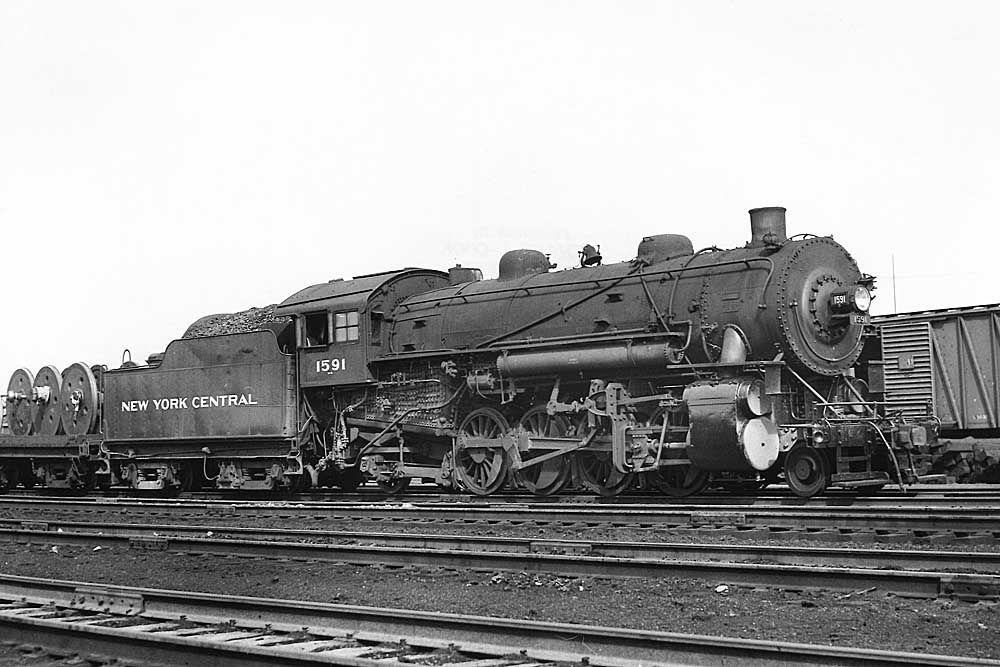 Steam locomotive standing in rail yard