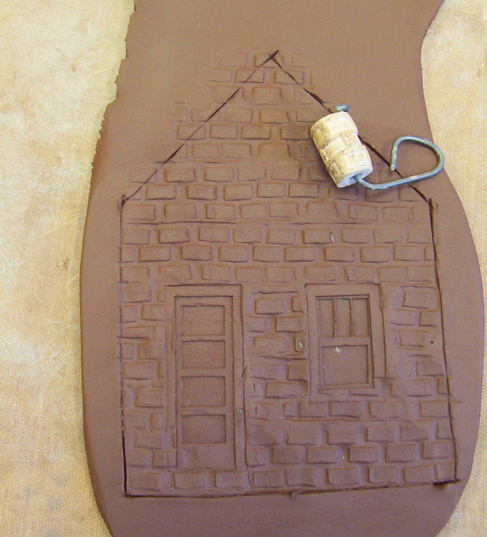 Brick impressions rolled into a clay building side