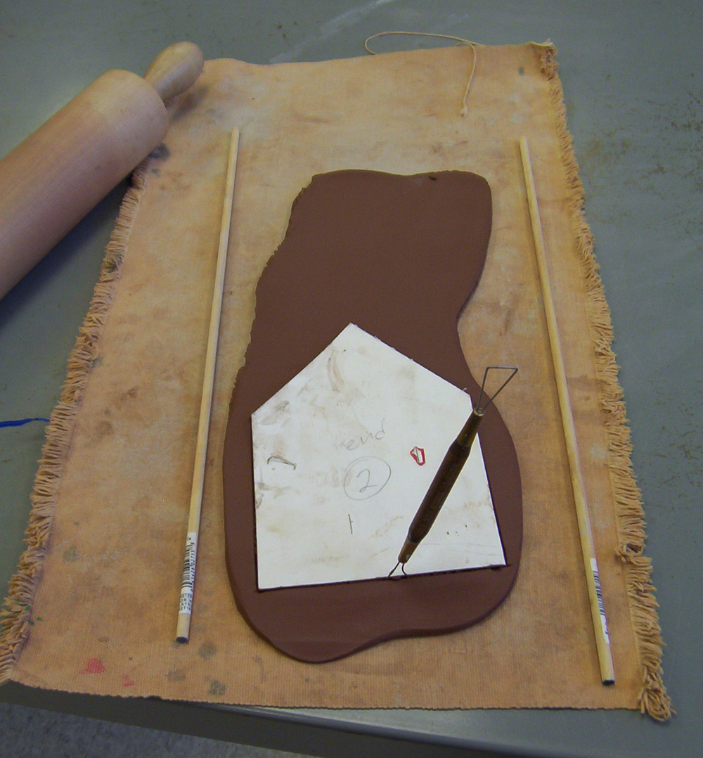 Cutting out a clay template