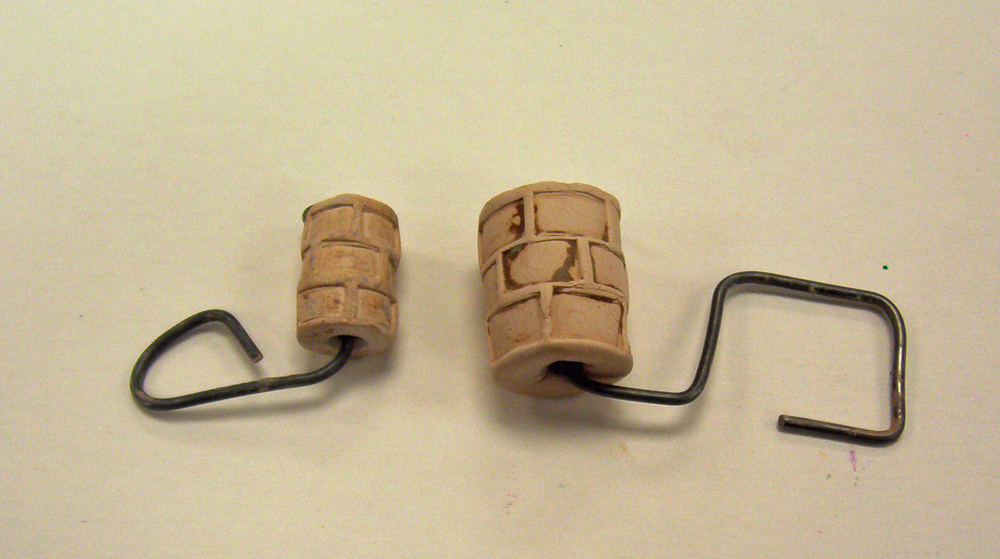 Two homemade roller tools for clay