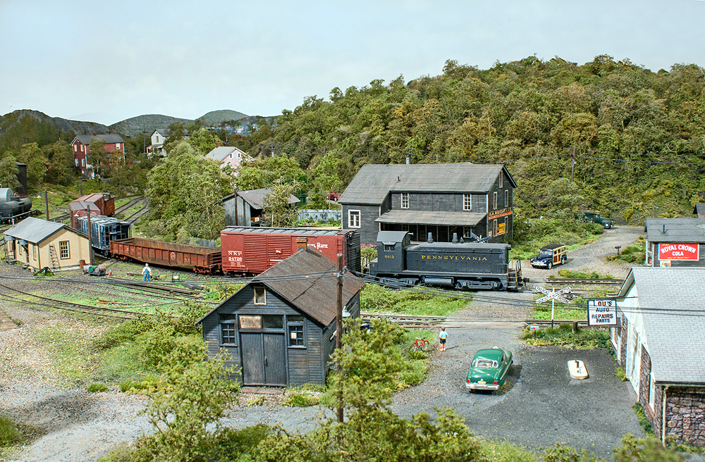 A train passes by rail served industrial sites