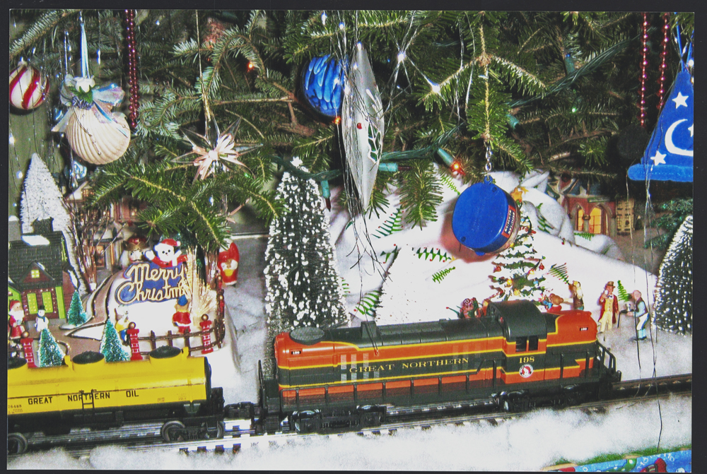 Toy trains under a Christmas tree