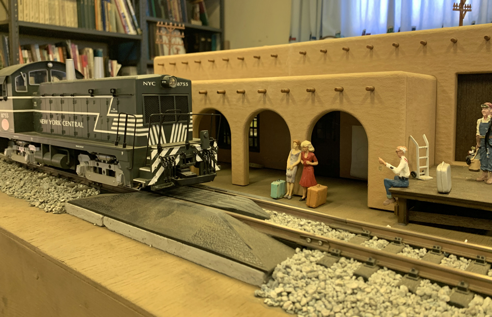 A large-scale engine near a model station