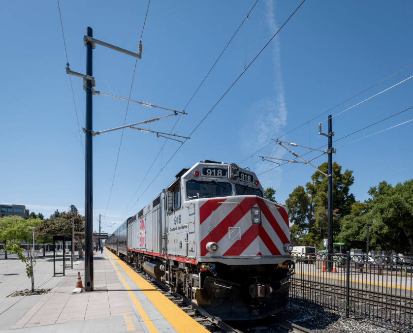 Diesel power commuter train under overhead wire