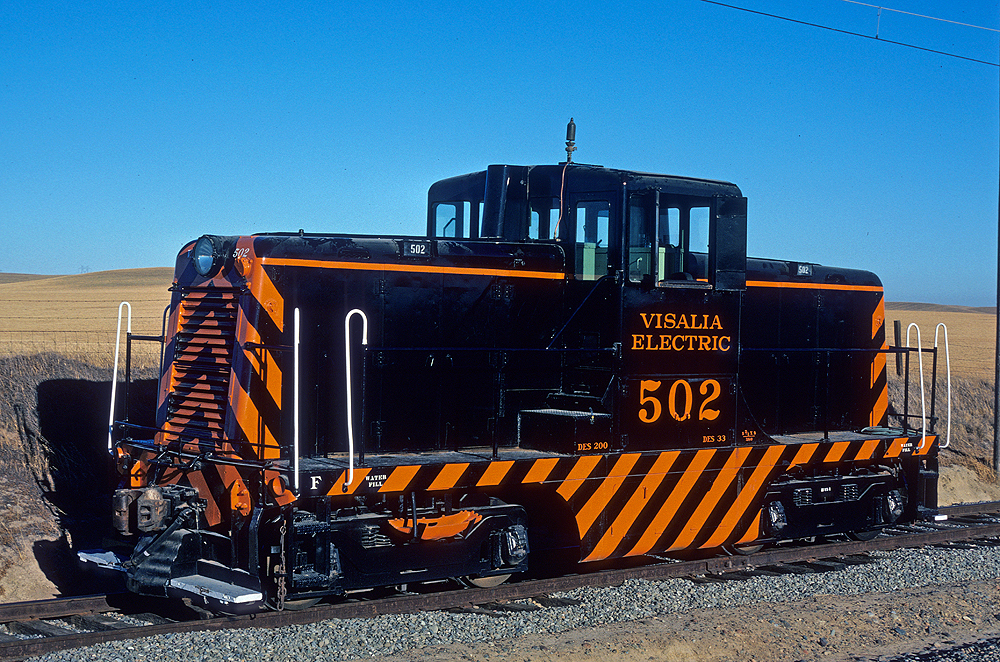 Top preserved diesel locomotives: A black and orange-stripped center cab diesel locomotive.