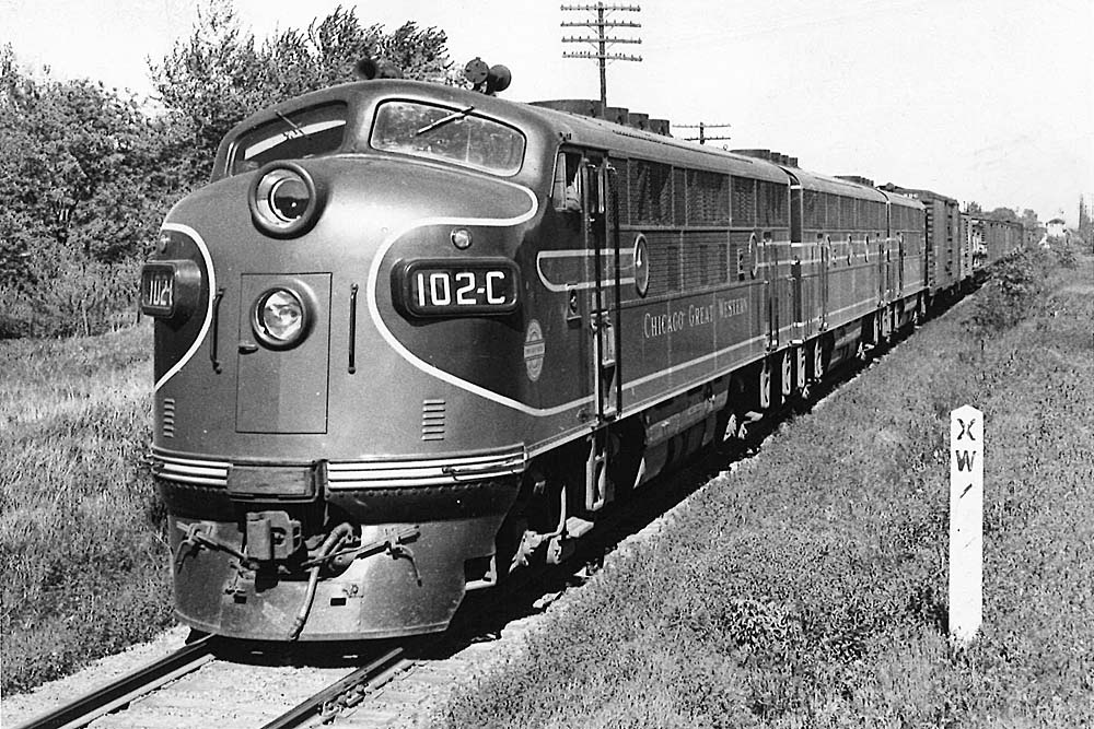 Streamlined diesel locomotives with freight train