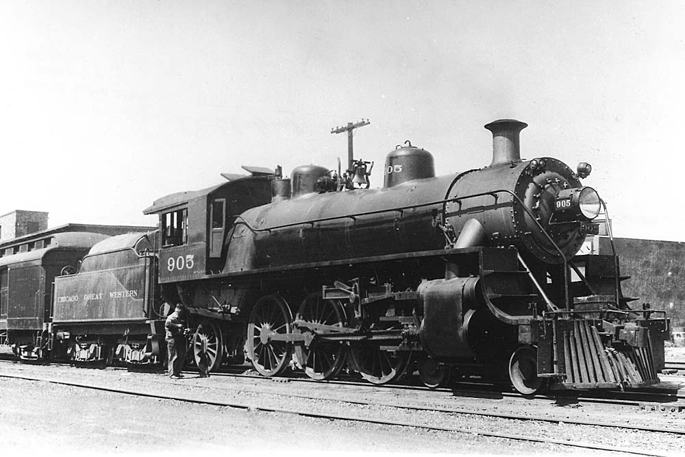 Steam locomotive coupled to passenger train