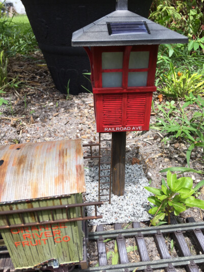 Solar-powered garden railroad building