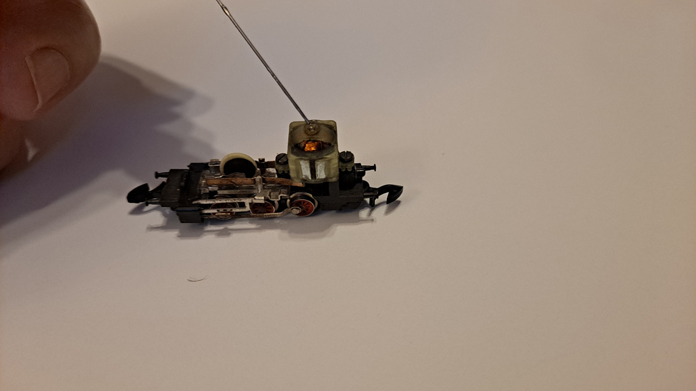 Needle nose oil dropper placed on top bearing of motor.