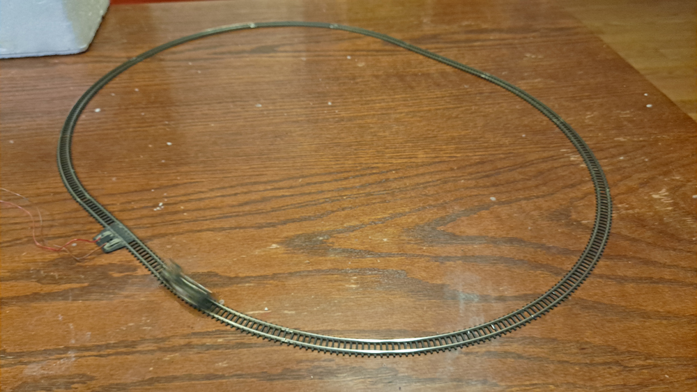 Locomotive frame on oval of track. Locomotive blurred as it passed by.