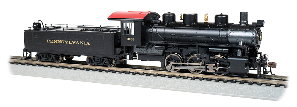 Black steam locomotive with tender.