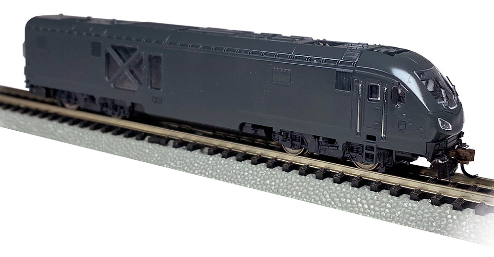 All-black unpainted locomotive model.