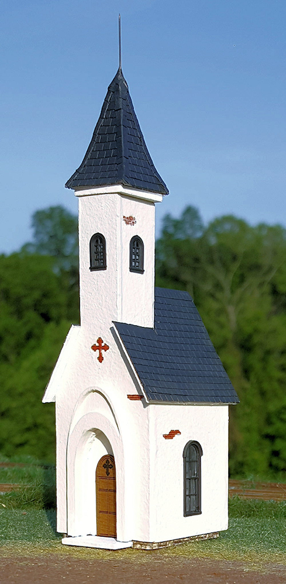 A HO scale white and blue chapel kit.