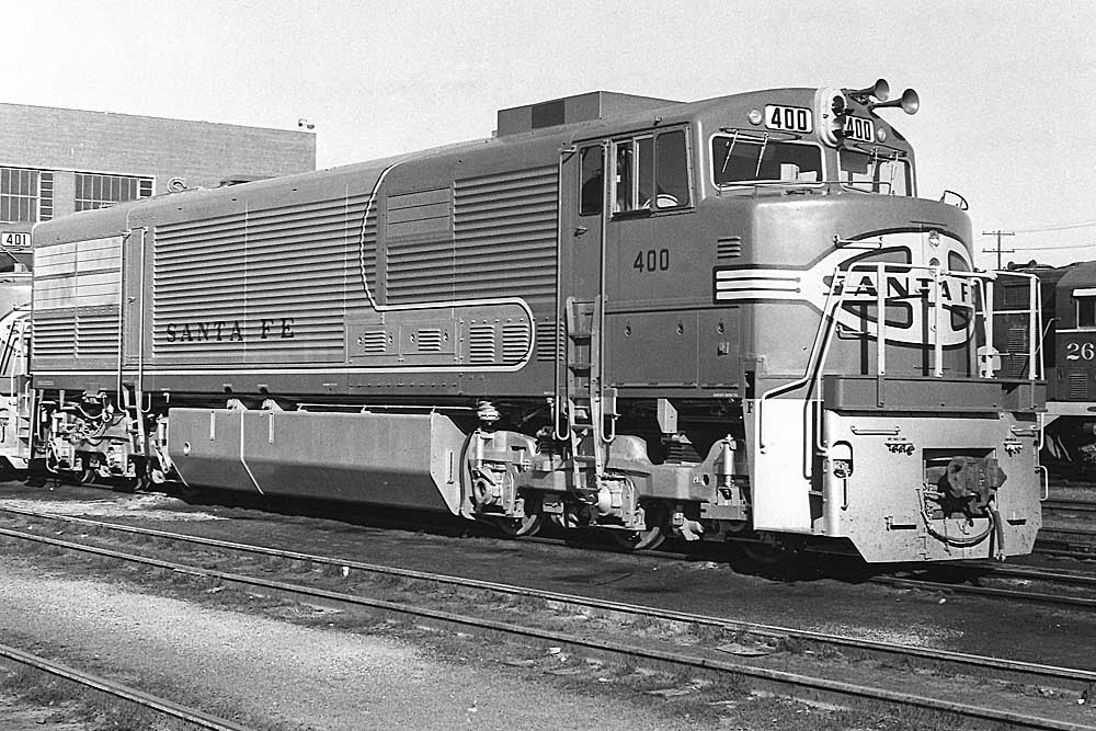 Shiny new diesel locomotive rests in yard