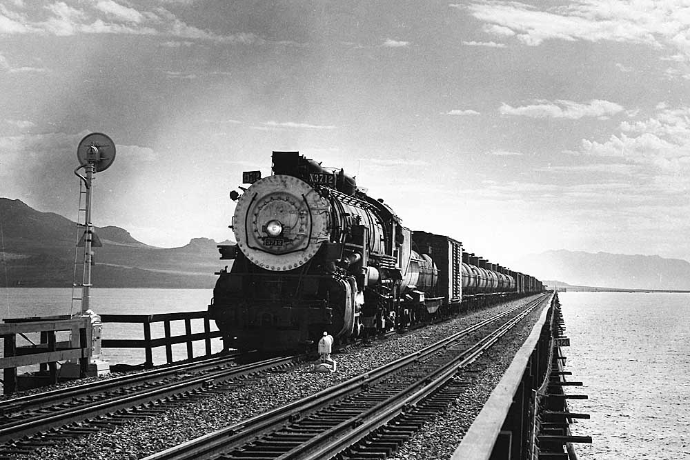 Southern Pacific freight trains: Steam locomotive leads freight train on bridge 