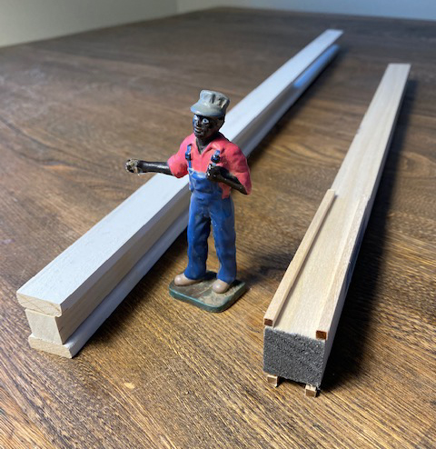 wood pieces next to a model figure