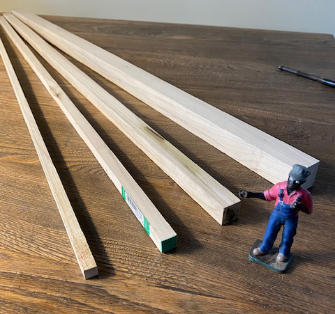 wood pieces next to a model figure