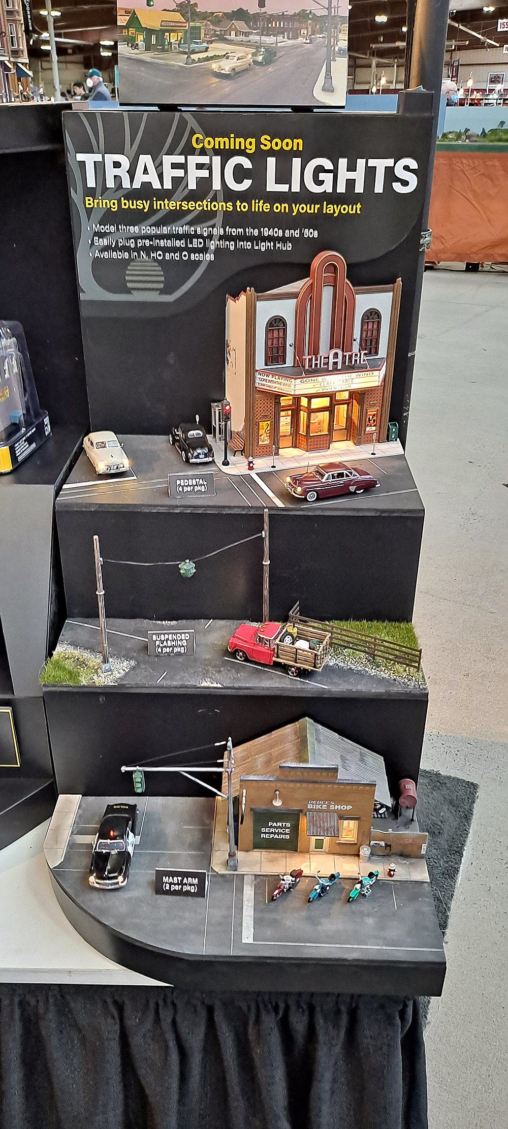 Display stand with street corners showing three types of traffic lights.