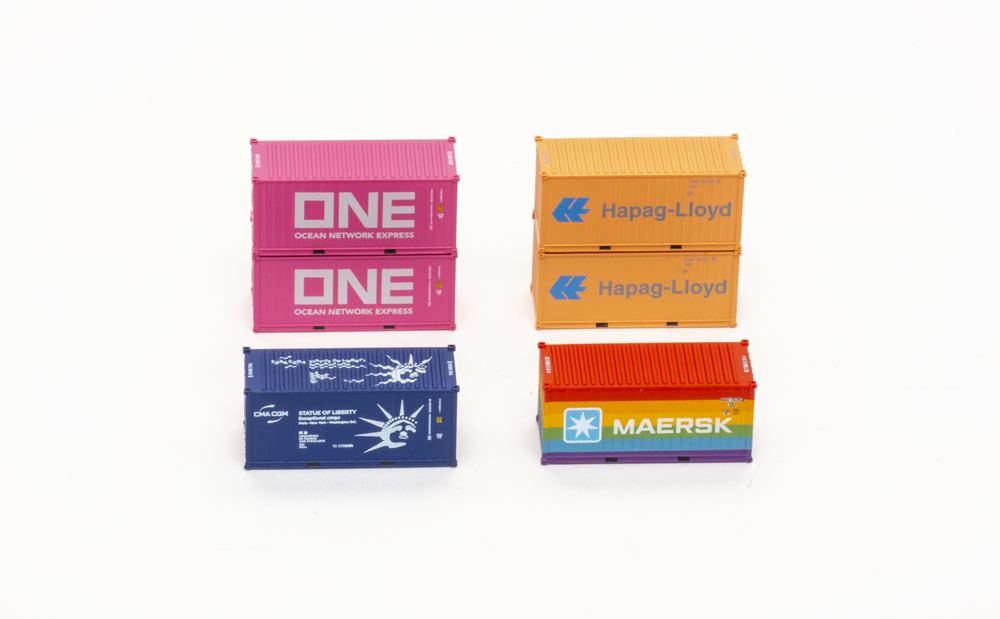 Photograph of N scale 20-foot intermodal containers in four different paint schemes.