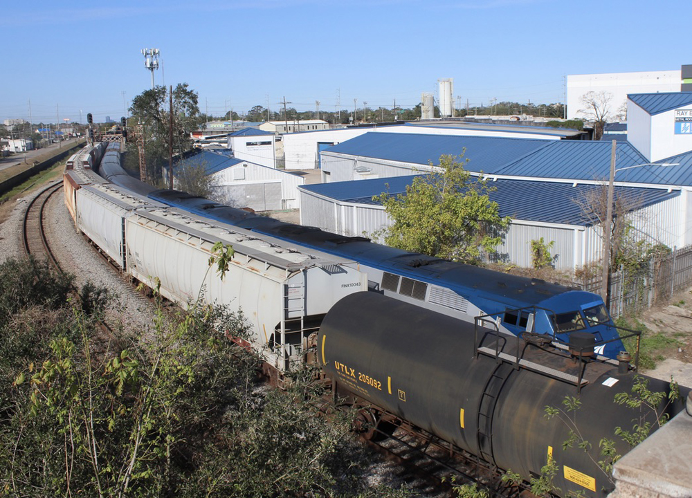 Passenger train passing stopped freight train