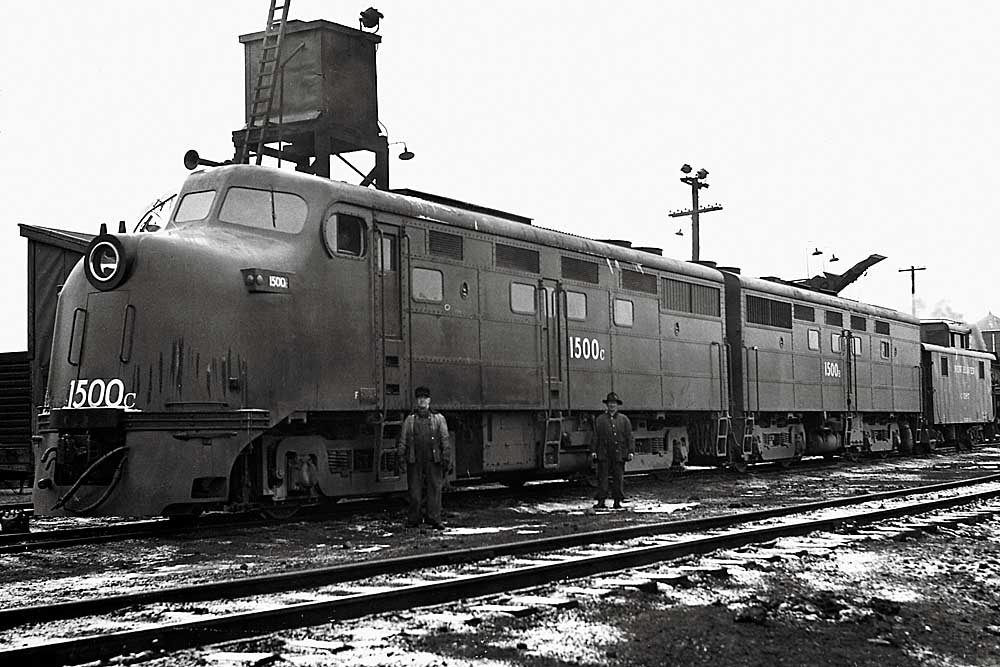 Streamlined diesel locomotive set in front of sanding tower