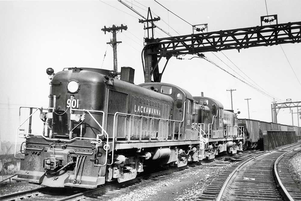 Diesel locomotives with coal train under catenary wires