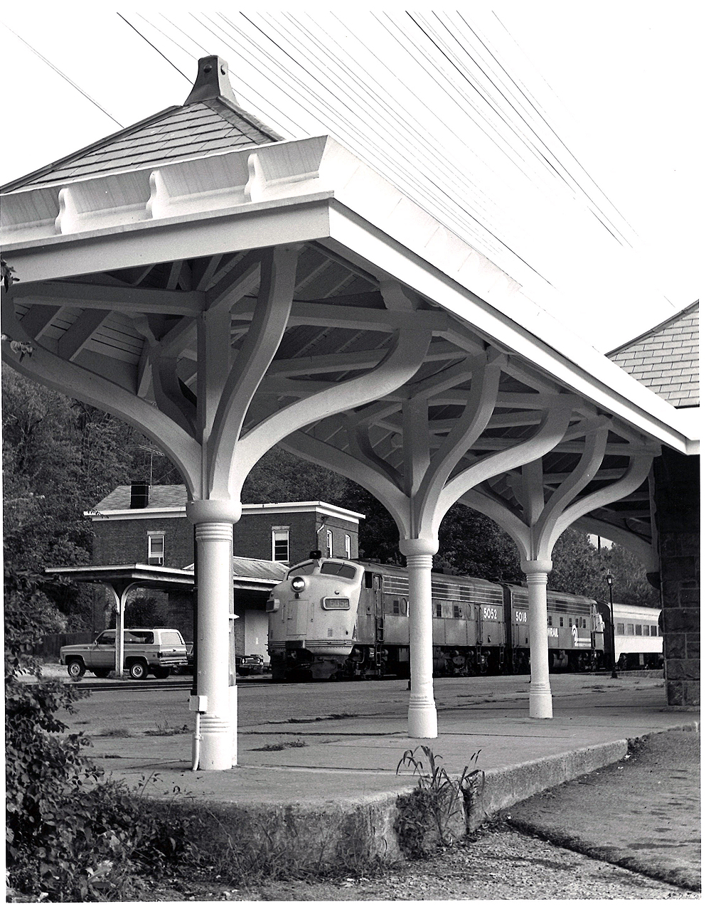 Conrail passenger trains: Streamlined passenger locomotives as seen through a Victorian-style passenger platform.