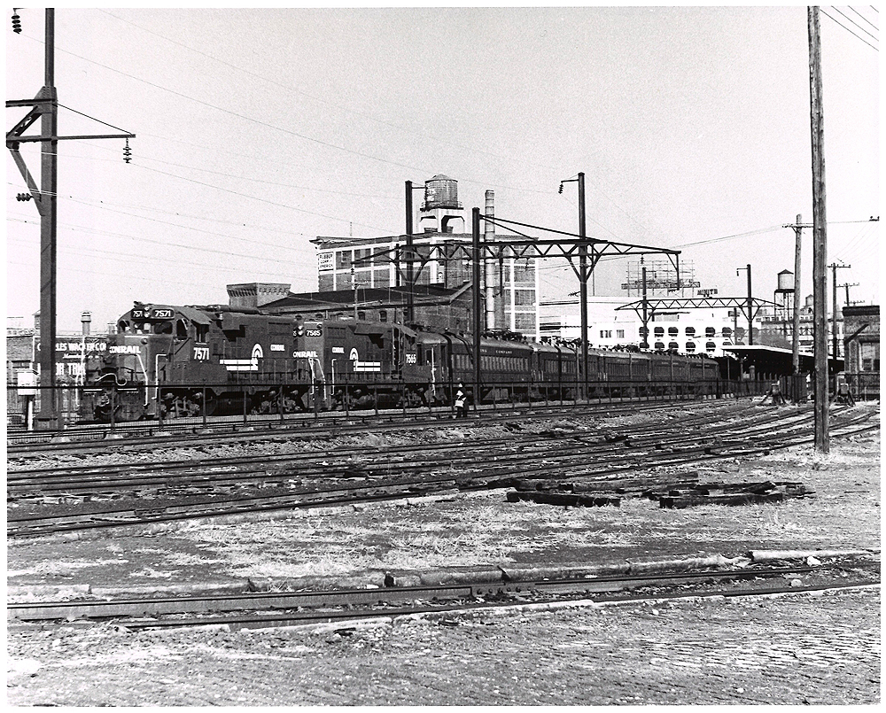 Conrail passenger trains: Two 1960s locomotives at the head of electric MU cars in a rail yard.
