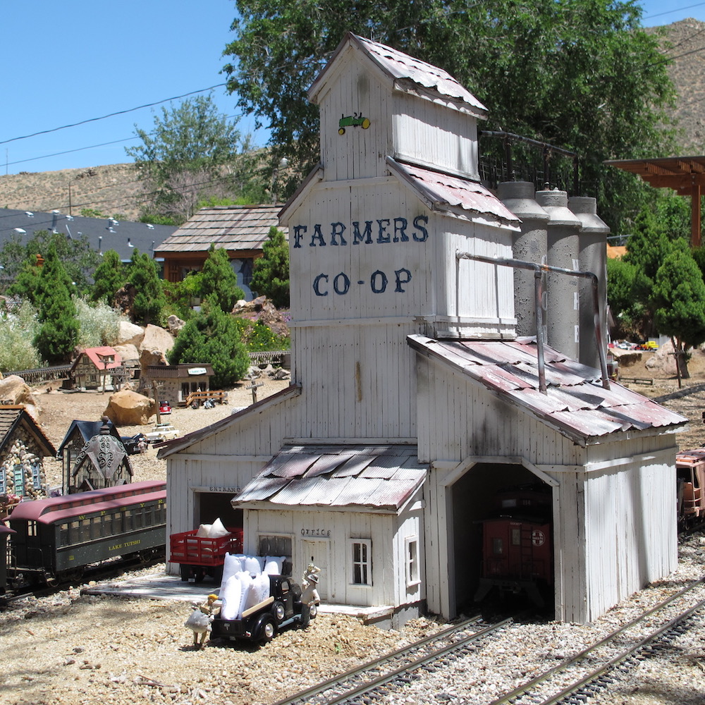 Model grain elevator on a garden railway.
