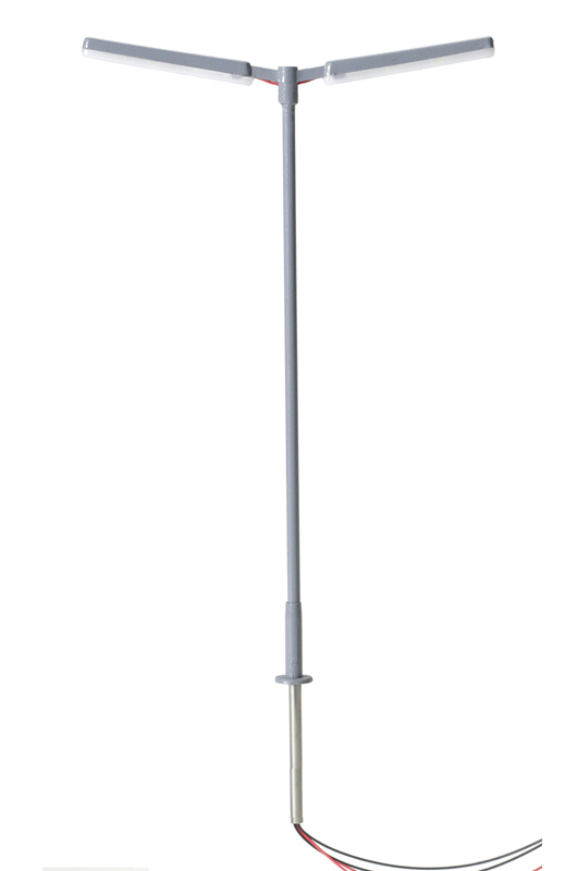 Photo of HO scale double-arm parking lot light with wires coming out of base.