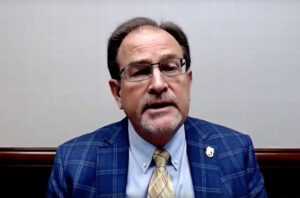 Man with blue coat and tie