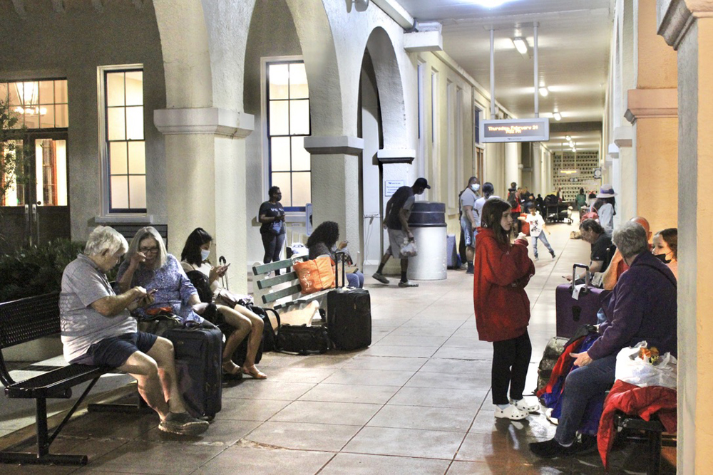 People waiting outside train station