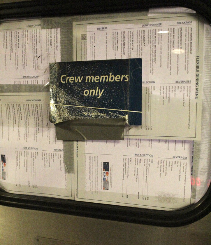 Dining-car menus taped to window