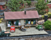 Model warehouse with vehicles parked nearby