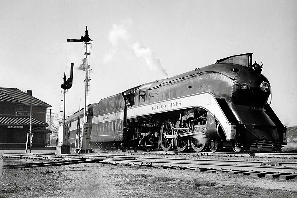 Streamlined steam locomotive by semaphore signals
